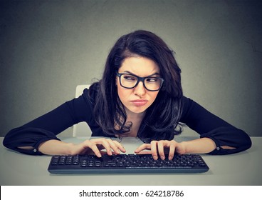 Crazy Looking Nerdy Woman Typing On The Keyboard Wondering What To Reply Plotting A Revenge 