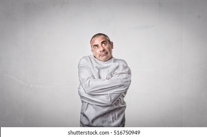 crazy man with straitjacket looking up