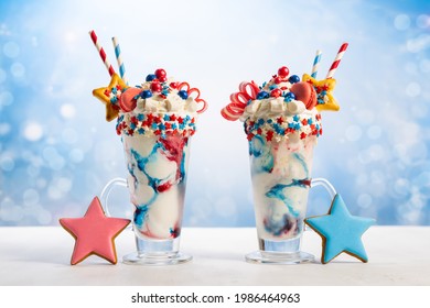 Crazy Milk Shake With Ice Cream,whipped Cream, Marshmallow,cookies And Colored Candy In Glass. Sweet Dessert For Fourth Of July. Idea Milkshake For Patriotic Day.