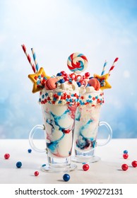 Crazy Milk Shake With Ice Cream,whipped Cream, Marshmallow,cookies And Colored Candy In Glass. Sweet Dessert For Fourth Of July. Idea Milkshake For Patriotic Day.