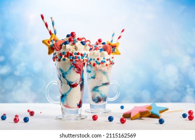 Crazy Milk Shake With Ice Cream,whipped Cream, Marshmallow,cookies And Colored Candy In Glass. Sweet Dessert For Fourth Of July. Idea Milkshake For Patriotic Day.