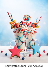 Crazy Milk Shake With Ice Cream,whipped Cream, Marshmallow,cookies And Colored Candy In Glass. Sweet Dessert For Fourth Of July. Idea Milkshake For Patriotic Day.