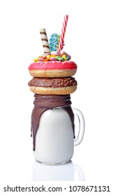 Crazy Milk Shake With Pink And Chocolate Donuts, Color Candy And Straw In Glass Jar Isolated On White Background