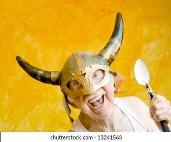 Crazy Old Man In A Tee-Shirt And A Viking Helmet