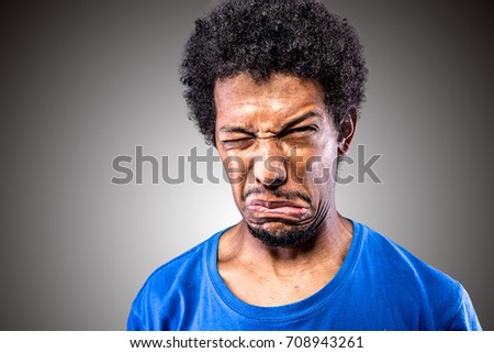Crazy ones making grimaces. Cringing and at the same time has a look of embarrassment