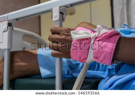 crazy patient restrain on bed in hospital