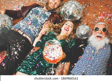 Crazy people celebrating at new year party at home - Soft focus on center girl face