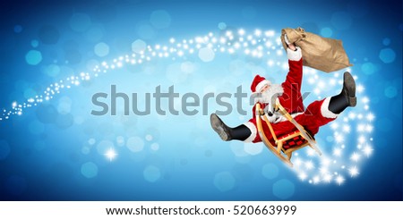 crazy santa claus on his sleigh hilarious fast funny crazy xmas christmas gift present delivery blue wide panorama bokeh background