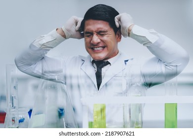 Crazy Scientist In Laboratory. Mad Scientist Inventor Concept. Frustrated Upset Research Man Feeling Tired Worried With Problem In Chemical Laboratory.