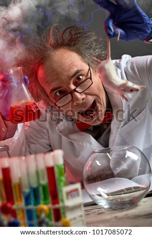 crazy scientist yelling while doing experiment on white mouse 