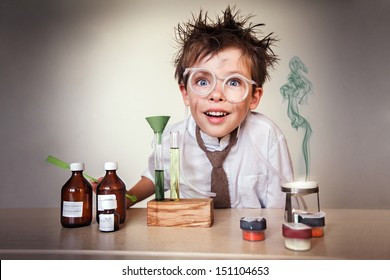 Crazy scientist. Young boy performing experiments - Powered by Shutterstock