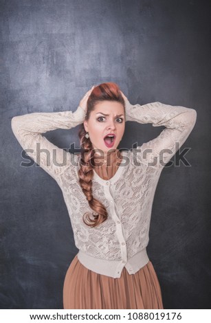 Crazy screaming woman on chalkboard blackboard background