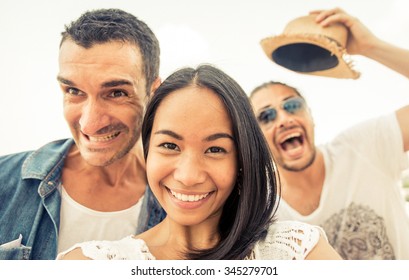 Crazy Selfie With Funny Faces. Three People Taking Self Portraits