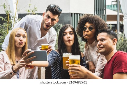 crazy selfie time of a millennials group of friends, people drinking beers and having fun using smartphone for making memories - Powered by Shutterstock