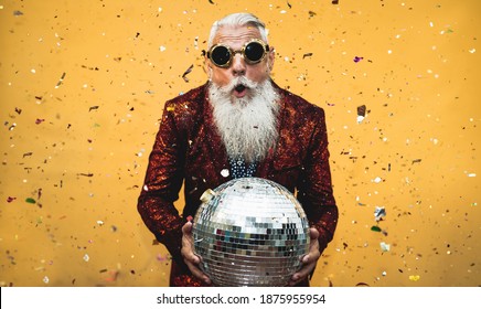 Crazy Senior Man Having Fun Doing Party During Holidays Time - Elderly People Celebrating Life Concept 