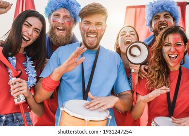 Crazy Sport Fans Playing Drums And Screaming While Supporting Their Team - Main Focus On Left Guy Face