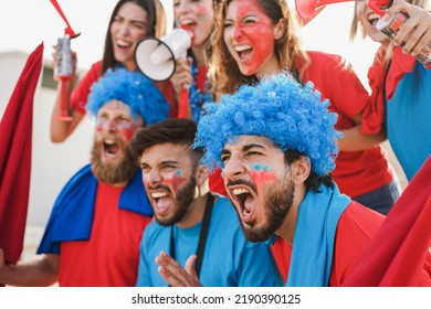 Crazy Sport Fans Screaming While Supporting Their Football Team - Soft Focus On Right Man Face