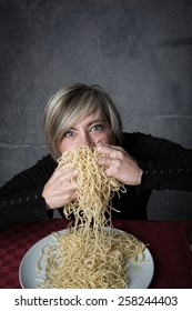 Crazy Woman Eating Big Dish Of Pasta