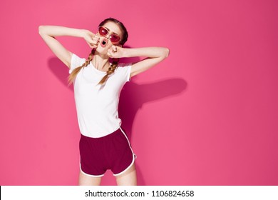 crazy woman in a point in a white T-shirt on a pink background logo                               