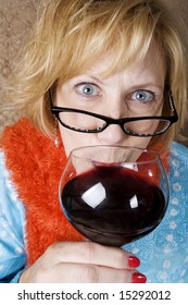 Crazy Woman With Wild Eyes Drinking Wine