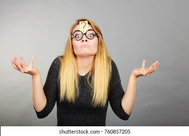 Crazy Wondering Face Expression Concept. Wierdo Nerd Woman Having Question Mark On Forehead And Geek Eyeglasses.