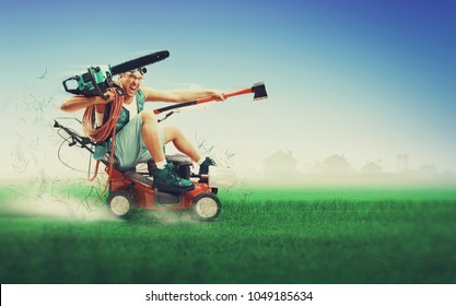 Crazy workman covered with instruments driving lawn mower over green grass