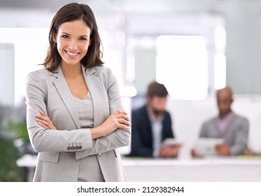 Cream always rises.... Shot of a young businesswoman standing in an office. - Powered by Shutterstock