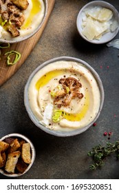 Cream Of Cauliflower Soup With Croutons, Thyme, Garlic, Olive Oil, Parmesan. Top View Overhead View Copy Space