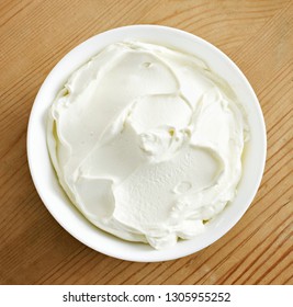 Cream Cheese, Quark Or Yogurt In A White Bowl. Dairy Product, Healthy Eating Theme. Wooden Table Background.