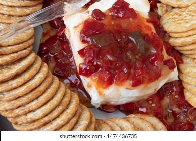 Cream Cheese And Red Pepper Jelly Relish With Crackers As An Appetizer