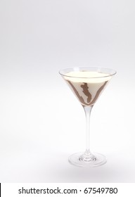 A Cream And Chocolate Pudding Served In A Martini Glass On A White Background