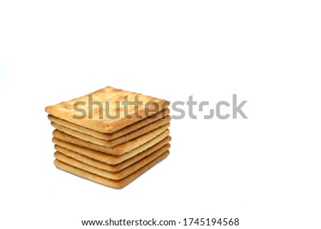 Cream cracker biscuit isolated on white background with copy space. 
