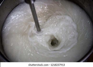 Cream is forming in a metal tank by homogenizer