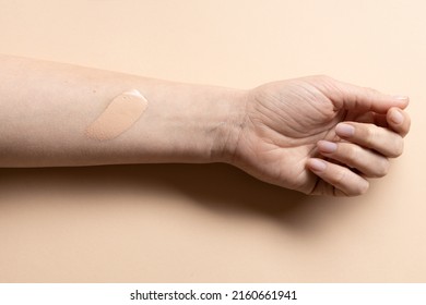 Cream Foundation Texture Smear On Woman's Hand, Cc Cream Text On Arm