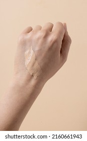 Cream Foundation Texture Smear On Woman's Hand, Cc Cream Text On Arm