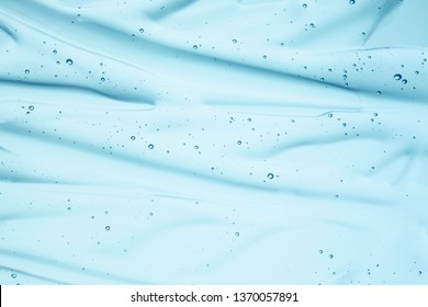 Cream gel gray blue transparent cosmetic sample texture with bubbles isolated on white background
