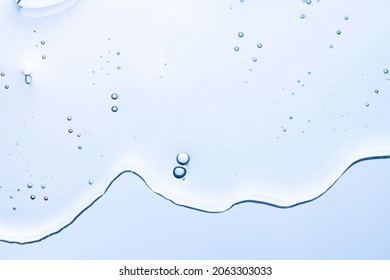 Cream gel gray blue transparent cosmetic sample texture and bubbles isolated white background