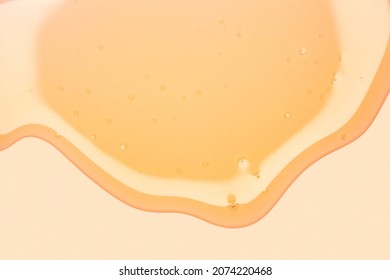 Cream Gel Orange Yellow Transparent Cosmetic Sample Texture With Bubbles On Peach Orange Background