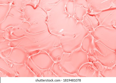 Cream gel pink transparent cosmetic sample texture with bubbles isolated on white background
