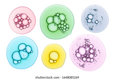 Cream gel transparent multi colored cosmetic sample texture with bubbles isolated on white background