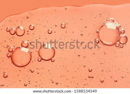 Cream gel yellow orange retinol vitamin c transparent cosmetic sample texture with bubbles isolated on white background