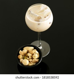 Cream Liqueur With Ice And Bowl Of Mixed Nuts. Conceptual Image View Shot