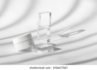 Cream Lotion Pot Cosmetics Showcase Presentation Mockup On White. White Creme Cosmetic Jar On Acrylic Geometric Pedestal Podium Block, Beauty Product Packaging With Shadows, High Angle View