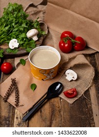 Cream Mushroom Soup In Disposable Cup Bowl Served With Green Vegetables. Image