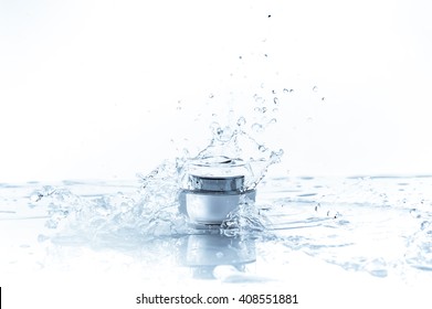 Cream Pot And Water Splash. Concept Beauty And Fresh

