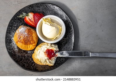 Cream tea and scones in Cornwall, England, UK - Powered by Shutterstock