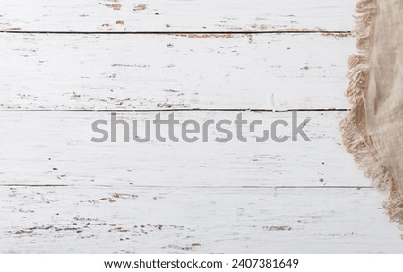 cream textured napkin linen hanging over grey rustic driftwood texture background, Mockup. Top view. Copy space. Stock fotó © 