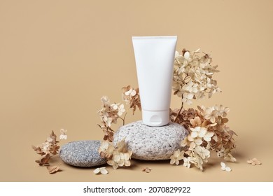 Cream Tube Mockup For Branding Presentation. Natural Skincare Beauty Product On Rounded Pebble Podium. Natural Earthy Colors