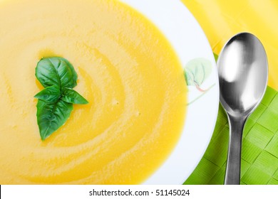 Creamy, Butter Yellow, Butternut Squash Soup With Herb Garnish.