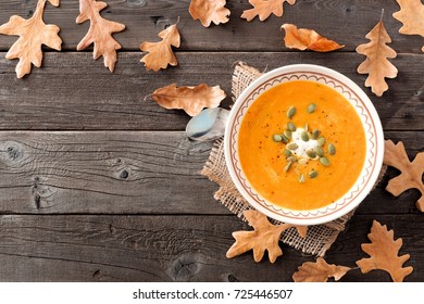 Creamy Butternut Squash Soup, Overhead Table Scene With Fall Leaves On A Rustic Wood Background